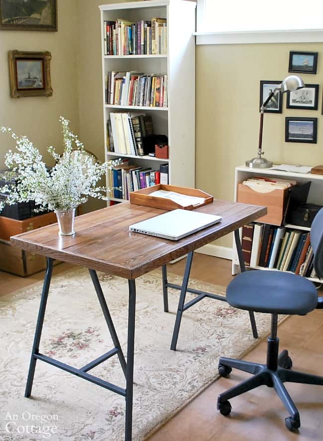 https://www.makingmanzanita.com/wp-content/uploads/2022/05/DIY-desk-with-Ikea-trestle-legs-and-salvaged-wood-flooring-top.jpg
