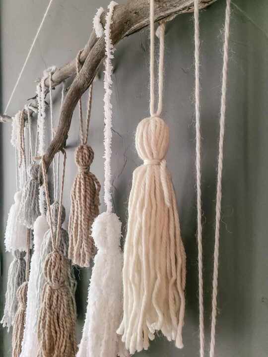 https://www.makingmanzanita.com/wp-content/uploads/2022/11/large-yarn-tassel-wall-hanging-540x720.jpg