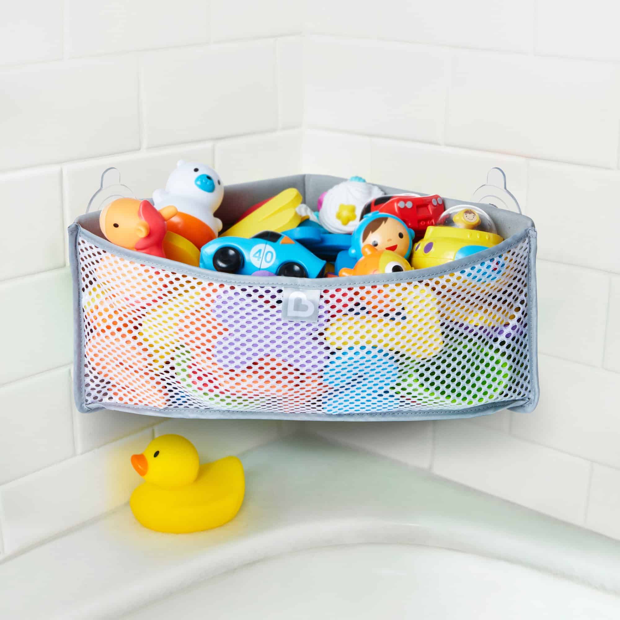 Use a shower rod and dollar store baskets to keep bath toys organized.