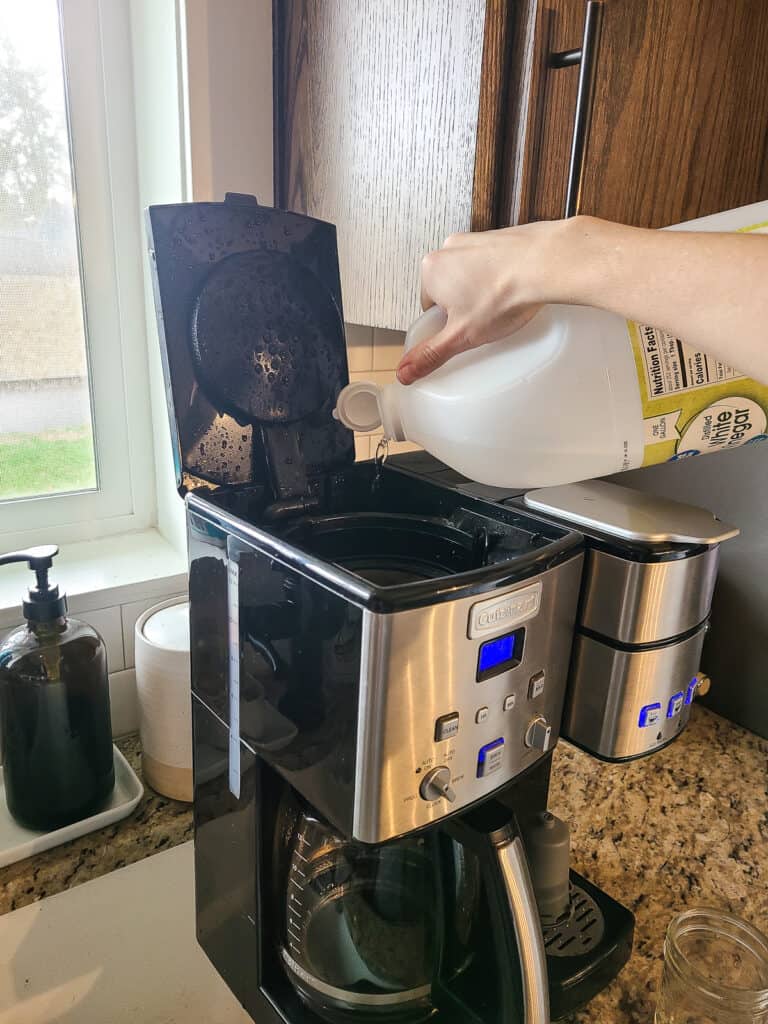 https://www.makingmanzanita.com/wp-content/uploads/2023/04/pouring-vinegar-into-coffee-maker-to-clean-768x1024.jpg