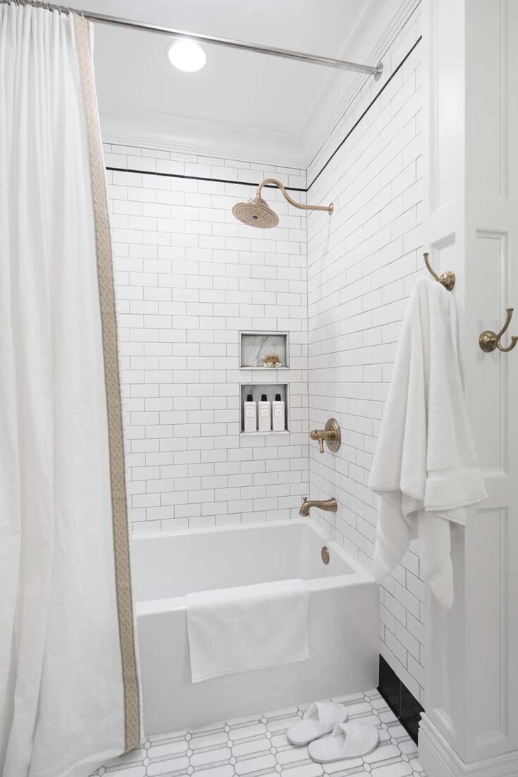 https://www.makingmanzanita.com/wp-content/uploads/2023/07/Classic-White-Shower-with-Subway-Tile-and-Brass-Plumbing-Fixtures.jpgfit10002c1498ssl1-735x1101.jpg